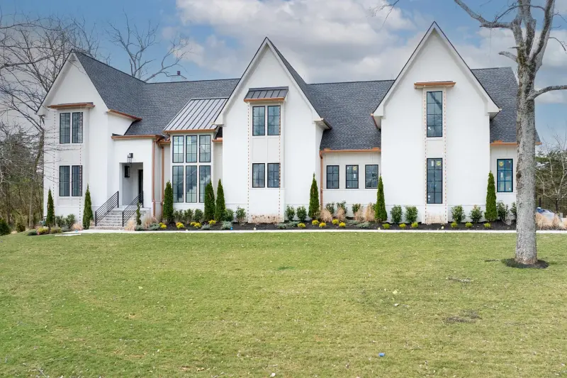 White-on-white modern with steep gabled roofline